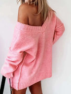 Back view of a woman in a pink off-the-shoulder sweater.