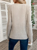 Back view of a woman in a beige ribbed knit top