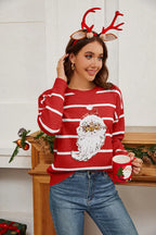 Back view of a woman wearing a red and white striped sweater