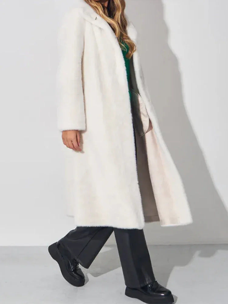 woman in white faux fur coat walking