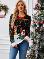 Woman wearing a black knit sweater with a Santa Claus playing guitar and a reindeer graphic, surrounded by musical notes and trees. The sweater has a red crew neck and white cuffs and hem.
