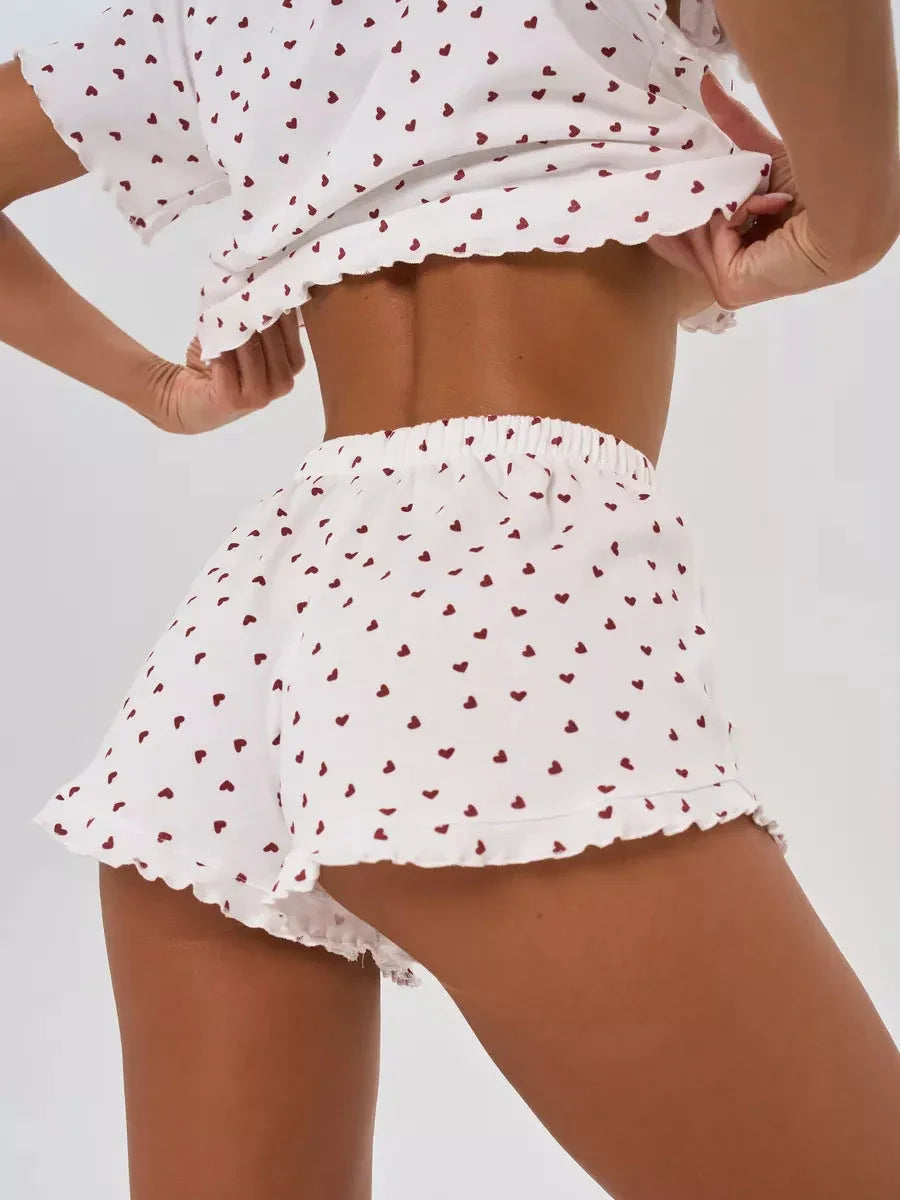 Close-up of the back of the pajama shorts showing the heart print and ruffled hem.