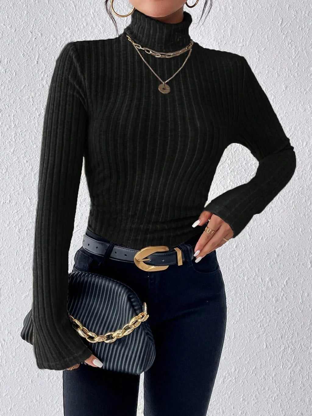 Close-up of a black ribbed knit turtleneck sweater