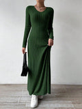 Person holding the hem of a ribbed knit maxi dress