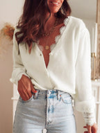 Close-up of a white lace-trimmed cardigan