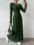 Woman wearing a green ribbed knit maxi dress