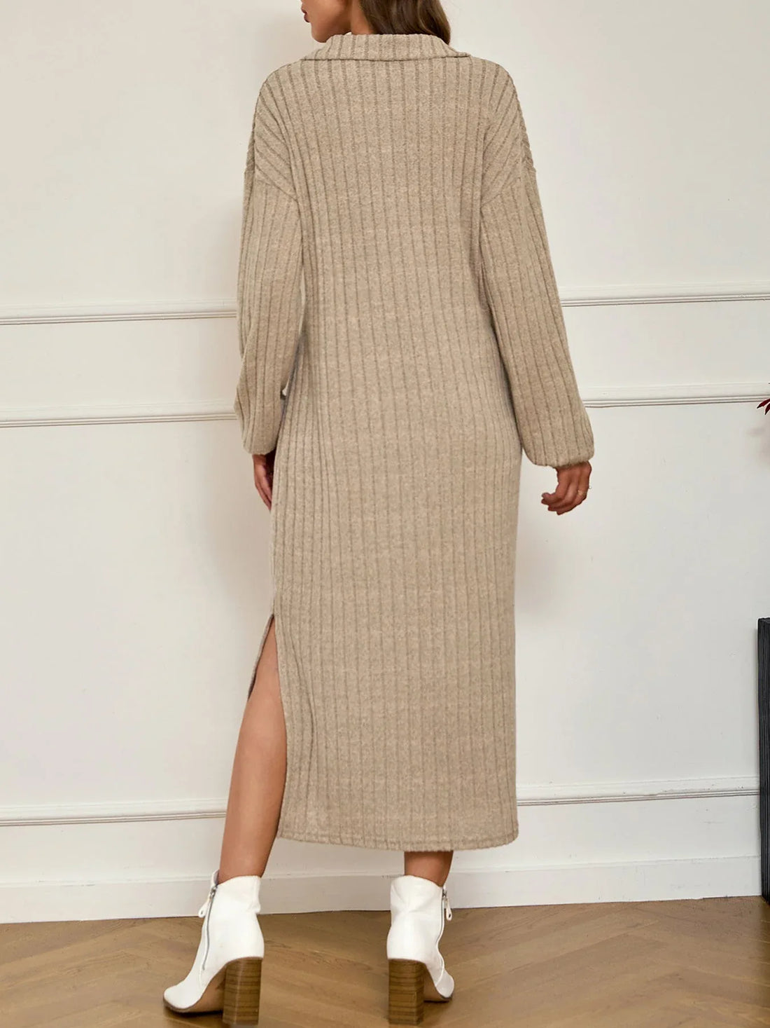 Woman wearing a beige ribbed knit maxi dress with a polo collar