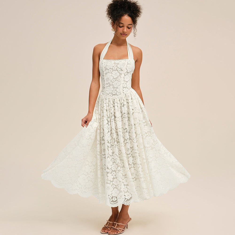 Woman wearing a white lace dress on a beige background