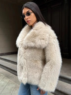 Close-up of the plush texture of an oversized lapel faux fur jacket