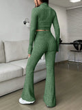 Back view of a woman in a green ribbed knit set with a cropped top and flared pants