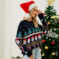 Close-up of a woman's face and shoulders wearing a dark blue Christmas sweater with a Santa Claus print.