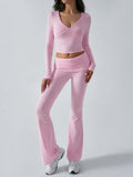 Close-up of pink knit crop top and flared pants