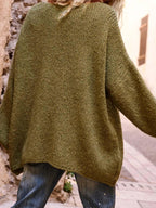 Back view of the olive green knit sweater, highlighting the textured knit pattern and long sleeves.
