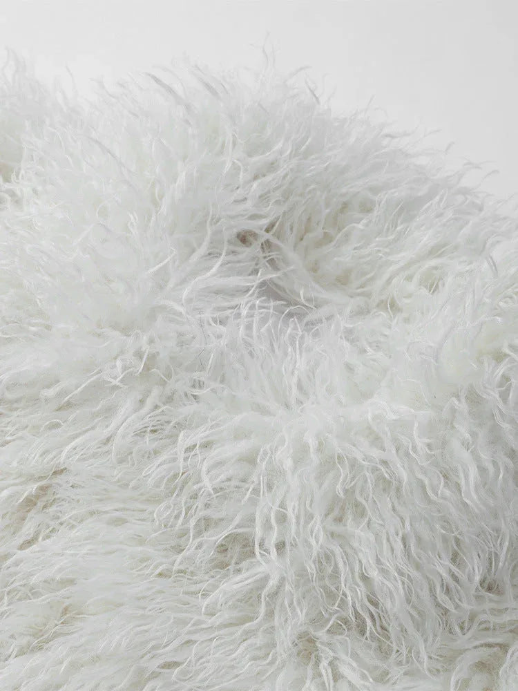 Close-up of cream shaggy faux fur texture