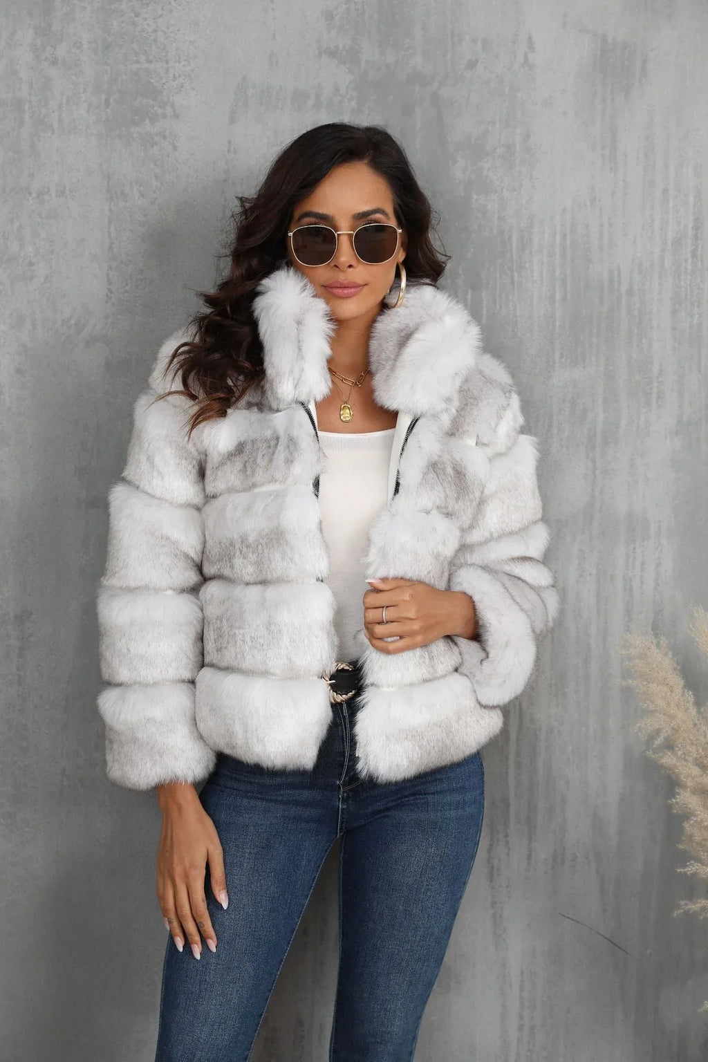 Woman wearing a white faux fur cropped jacket