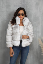 Woman wearing a white faux fur cropped jacket