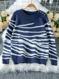 Woman wearing a white and brown zebra print crew neck sweater - View 8 | WEUXS