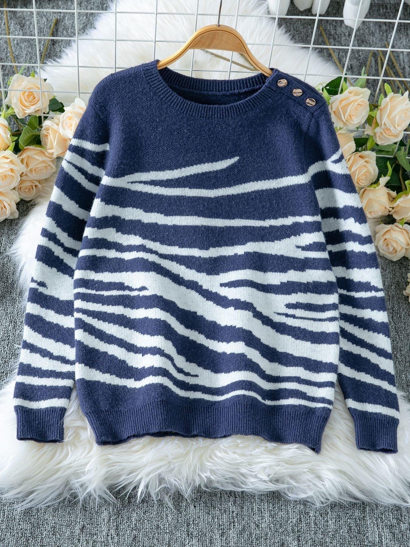 Woman wearing a white and brown zebra print crew neck sweater - View 8 | WEUXS