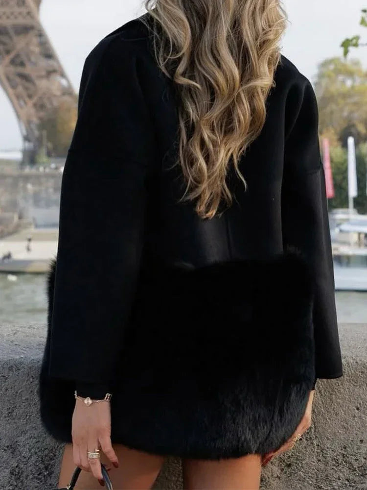 Back view of a black wool blend coat with faux fur detailing