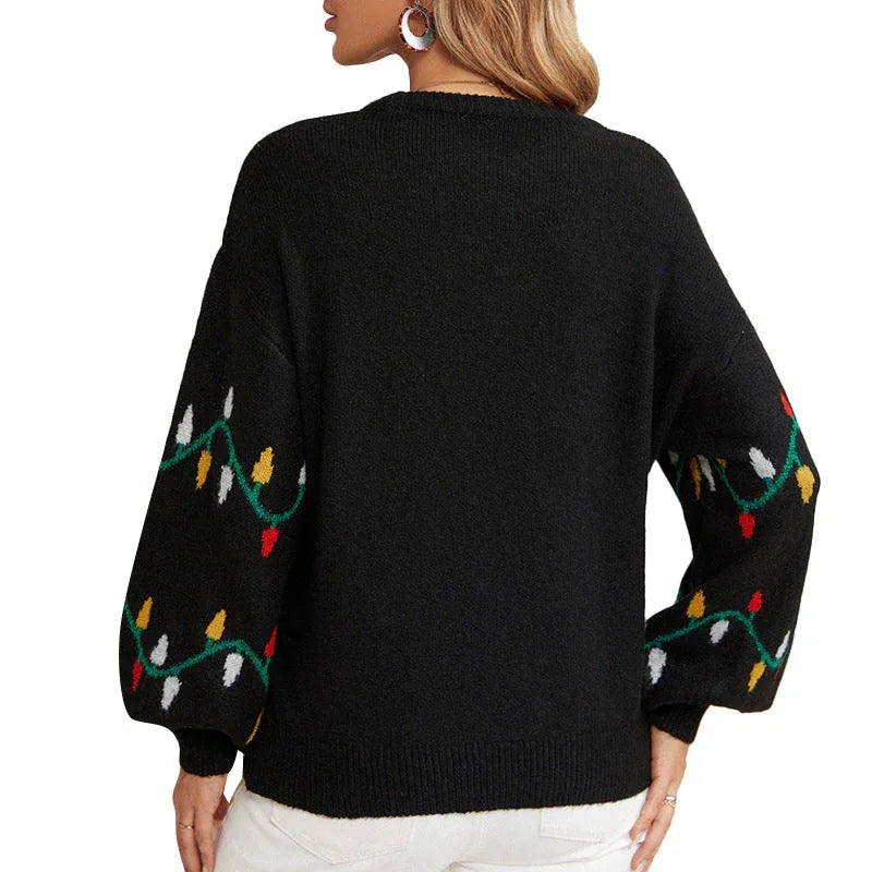 Woman wearing a black knit sweater with a string light pattern