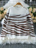 Woman wearing a white and brown zebra print crew neck sweater - View 7 | WEUXS