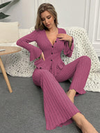 Close-up of a woman wearing a purple ribbed peplum lounge set