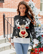 Woman wearing a black Christmas sweater with a reindeer graphic and snowflake pattern.