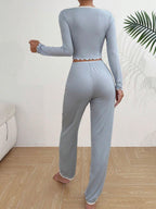 Back view of light blue ribbed knit pajama set with white lace trim.