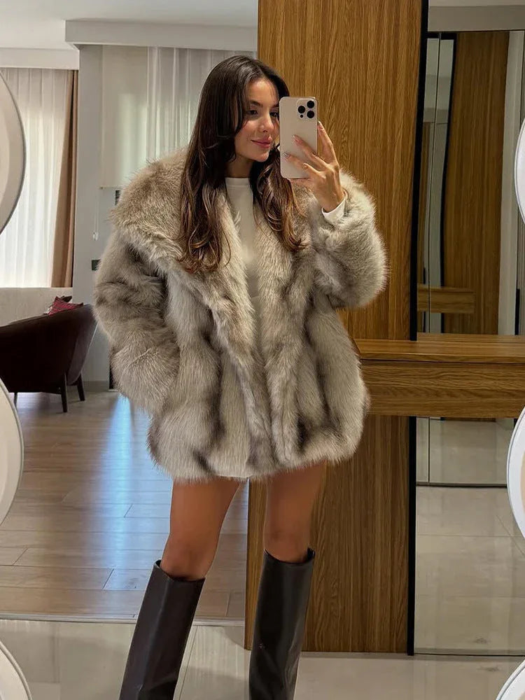 Front view of a woman in a fluffy faux fur coat.