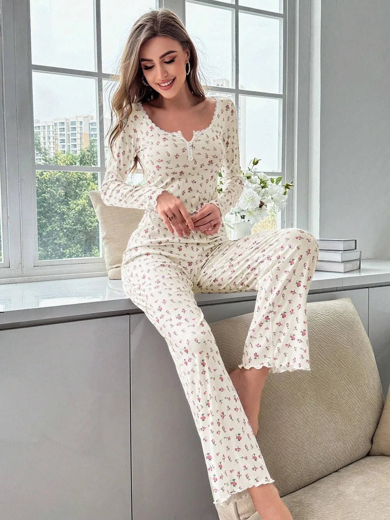 Woman posing in floral print pajama set