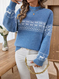 Woman wearing a blue Nordic snowflake mock neck sweater