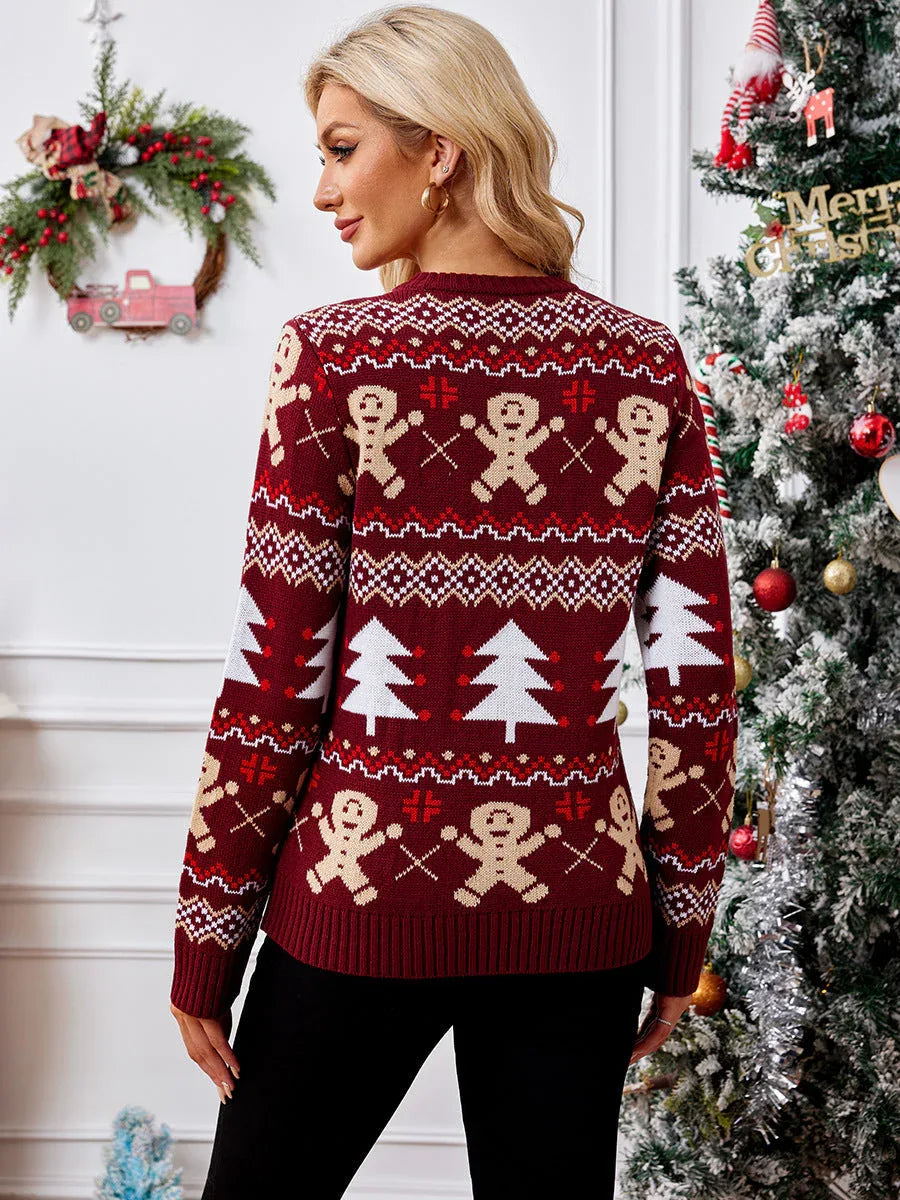 Back view of a woman wearing a burgundy knit sweater with gingerbread man and Christmas tree pattern.