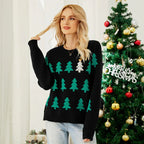 Woman wearing a black Christmas tree knit sweater with sequin accent