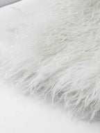 Close-up of cream shaggy faux fur texture detail