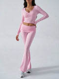 Woman wearing a pink wrap crop top and flared pants