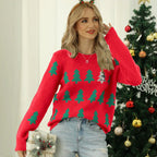 Close-up of the sequin Christmas tree detail on a knit sweater