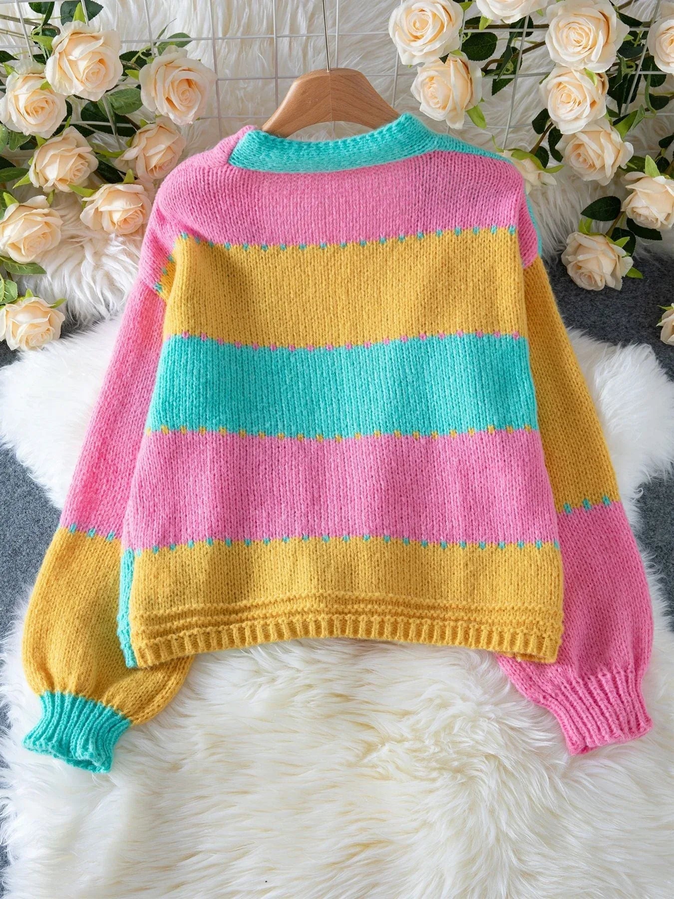 Back of a multi-colored striped knit cardigan