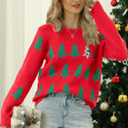 Full view of a woman in a festive Christmas tree sweater