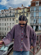 Street style fashion featuring a unique button-front knit sweater