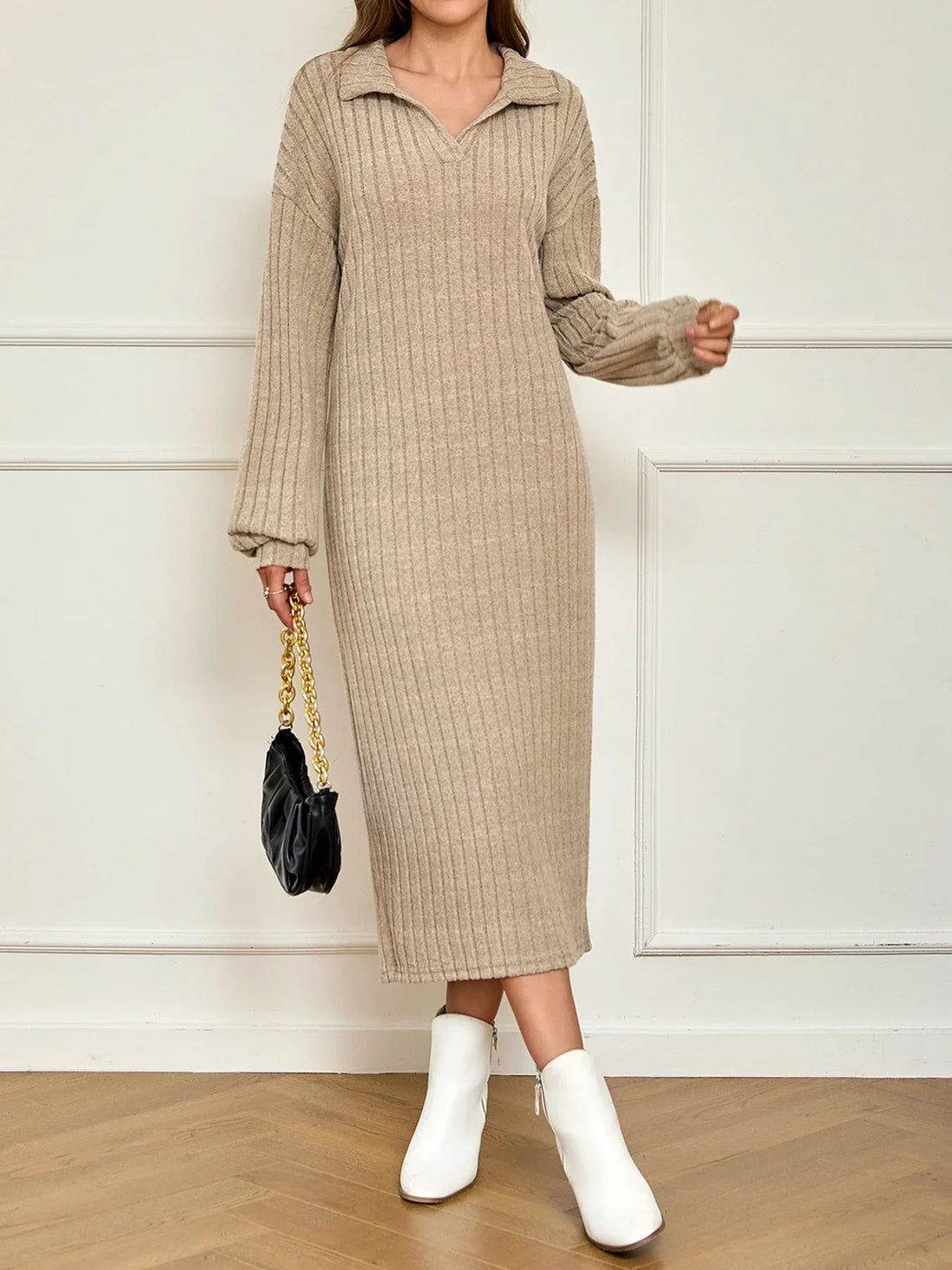 Woman wearing a beige ribbed knit maxi dress with a polo collar