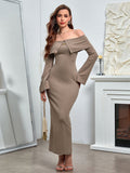 front view of a woman in a taupe off-the-shoulder knit dress with a fold-over collar