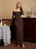 Full-length portrait of a woman in a brown shimmering dress