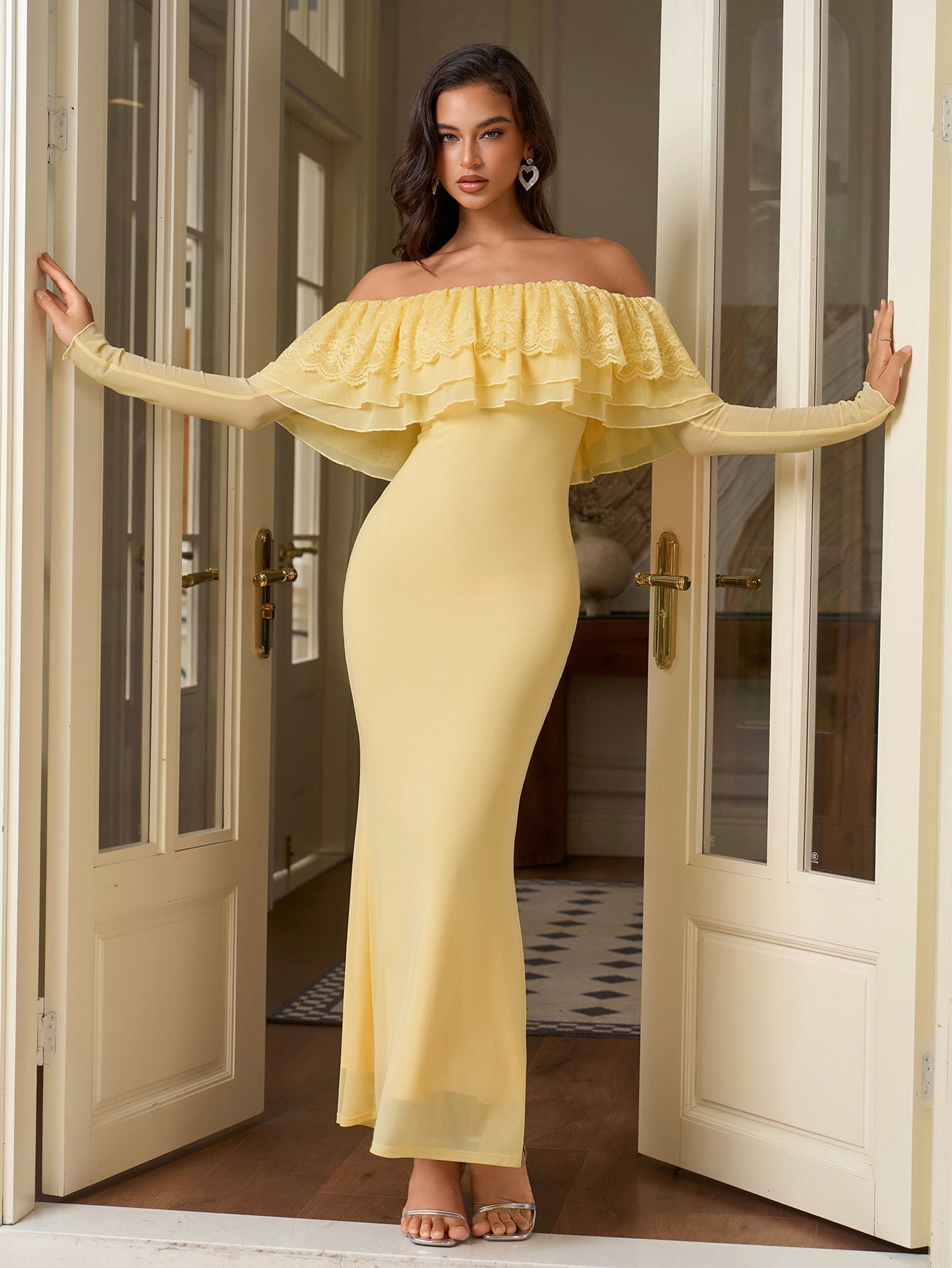 Full length view of a woman in an elegant yellow gown