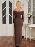 Back view of a woman in a long brown off-the-shoulder evening gown