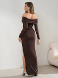 Back view of a woman in a brown off-the-shoulder ruched maxi dress with a side cutout and high slit