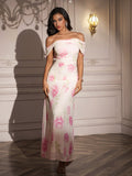 Full length shot of a woman in a white off-the-shoulder maxi dress with a pink floral print.