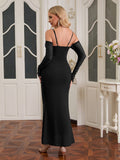 Back view of a black off-the-shoulder mermaid gown with long sleeves.
