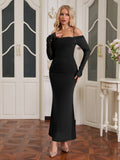 Front view of a woman in a black fitted mermaid dress with detachable long sleeves.