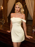 Woman in a cream off-the-shoulder satin mini dress leaning on a wooden bar