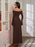 Back view of a woman in a long brown off-the-shoulder dress with flared sleeves